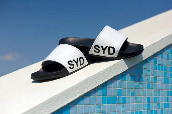 SYD slides side logo